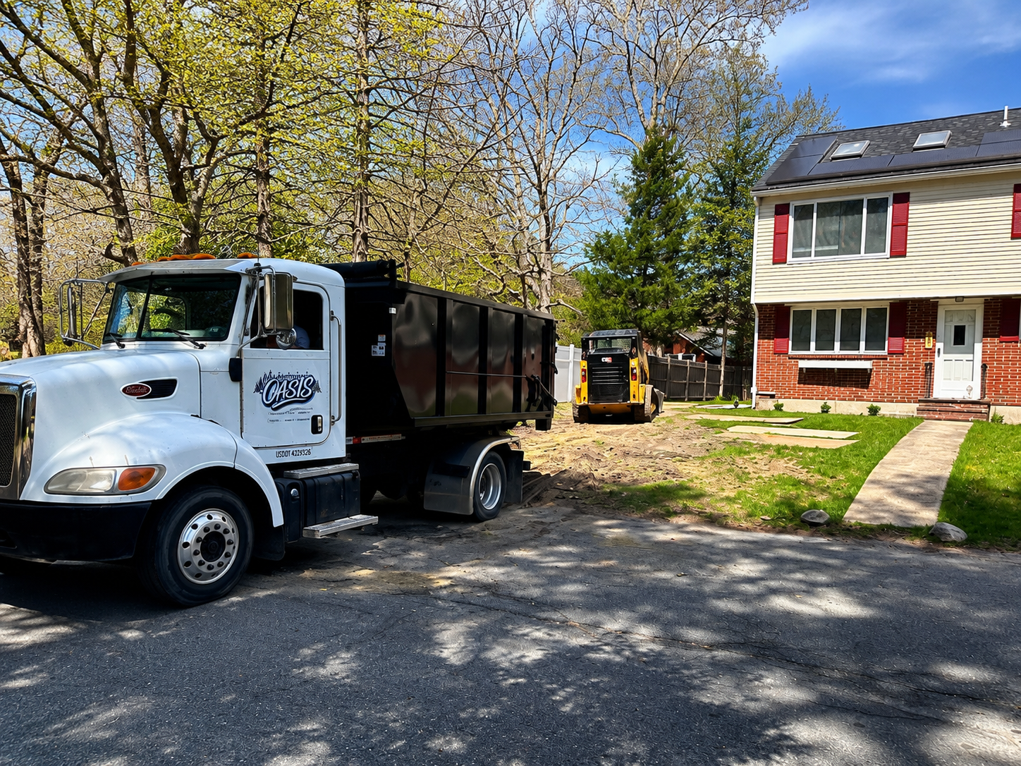 outdoor-oasis-dump-truck-landscaping-jobsite-halifax-ma-4x3